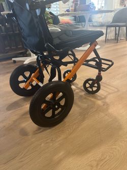 Transport wheelchair