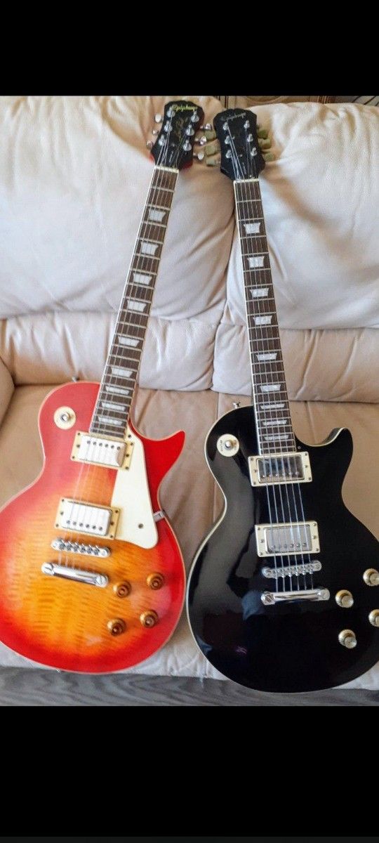 Epiphone quality Les Paul Guitars with a Cool Gibson Gig Bag $405 Each Or Trade; Great Shape & Performing Great Sounds with New Strings on. 