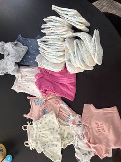 Newborn clothes and diapers