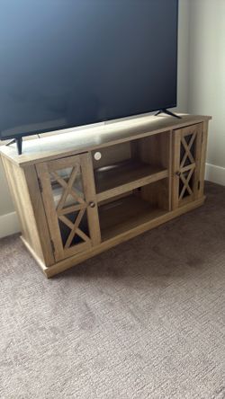 Wooden tv stand with glass compartment doors