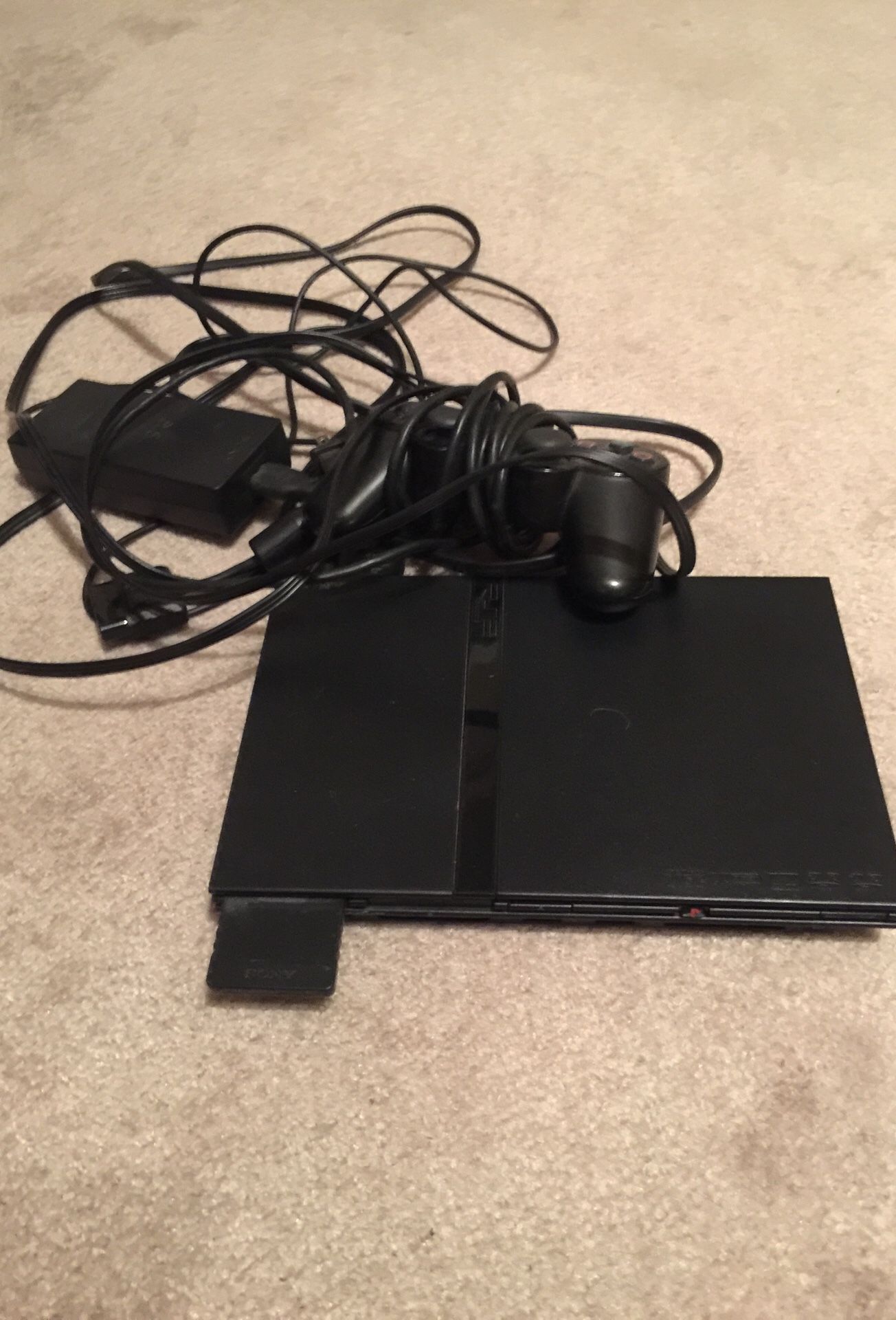 PS2. (Non working) And 47 games in travel case
