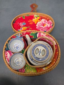 Chinese tea set with padded wicker basket