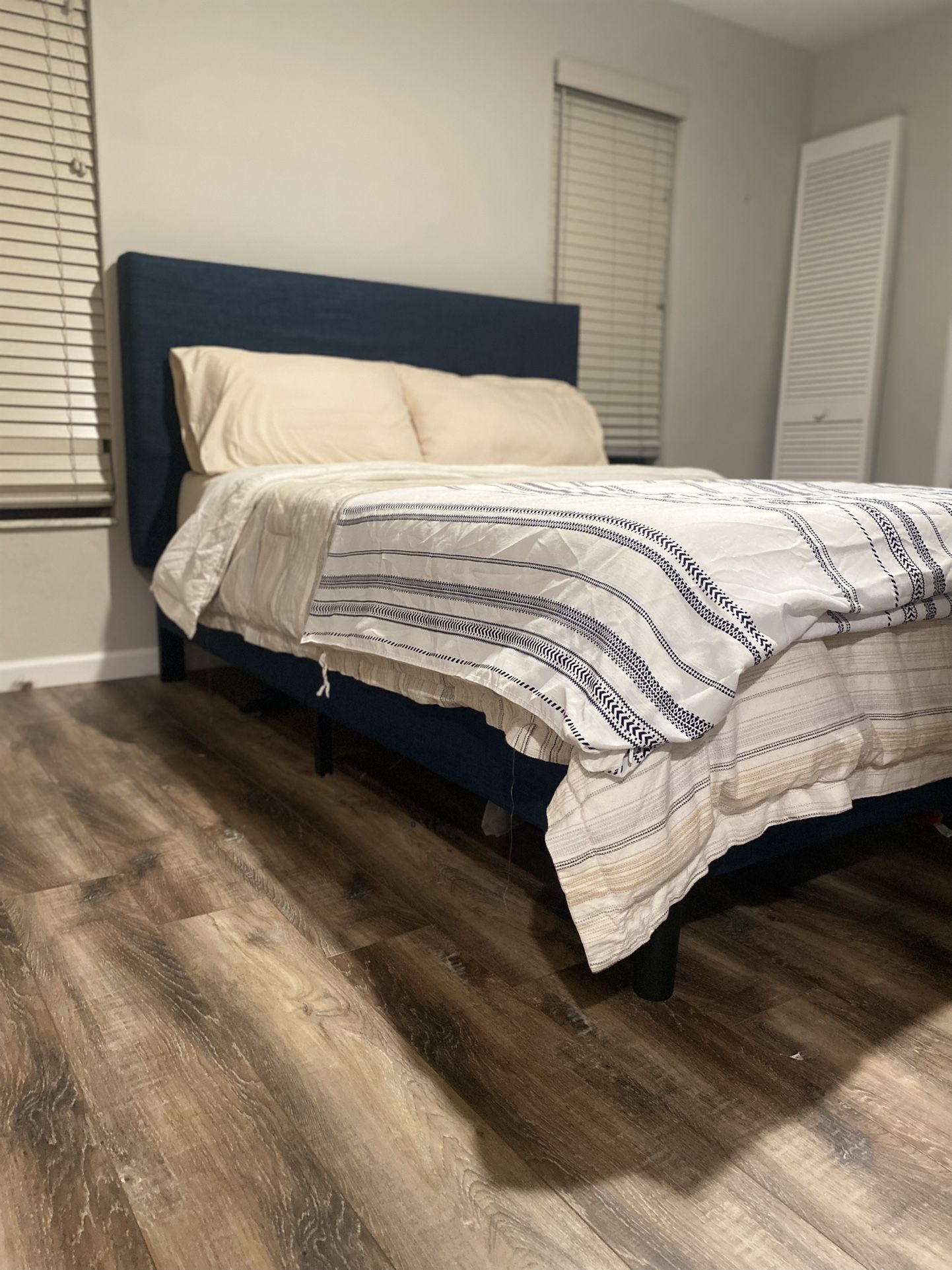 blue fabric and wood queen size bed frame