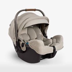 Nuna PIPA ™ rx Hazelwood Light Brown Infant Car Seat + PIPA RELX Base