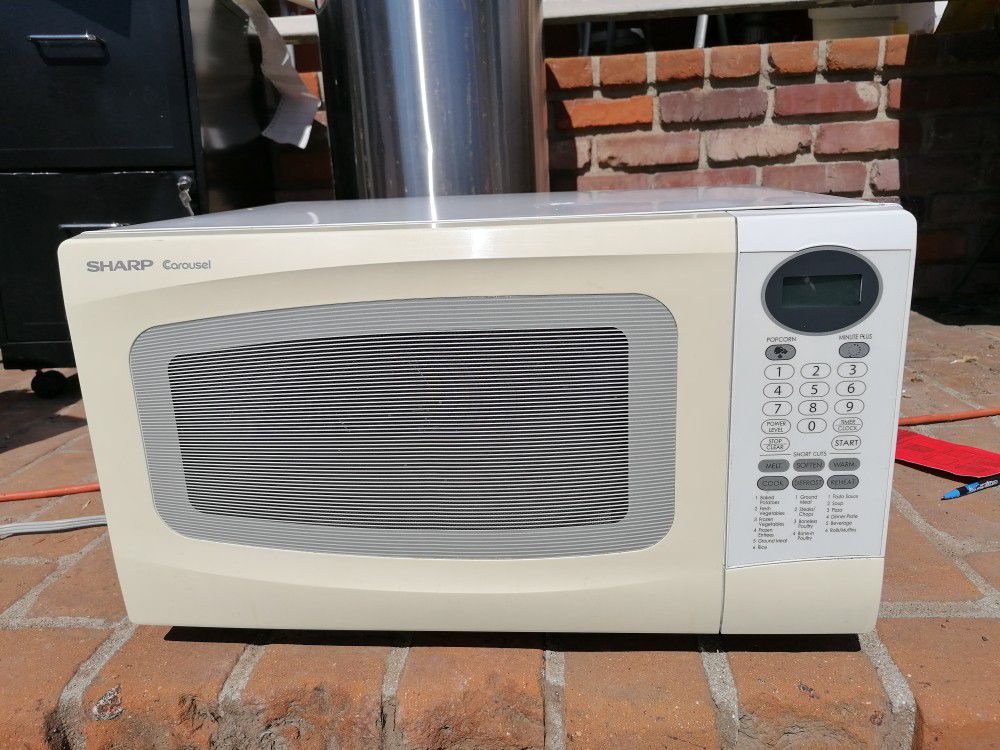 Like new Sharp Corousel white Microwave model R-306LW, 2.36 cu ft