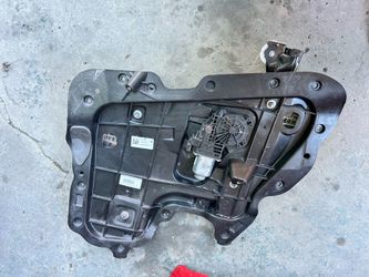 This is a genuine Tesla Model 3 rear passenger-side window regulator and motor assembly
