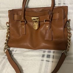 Woman’s Michael Kors purse