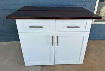 Large white wooden kitchen island