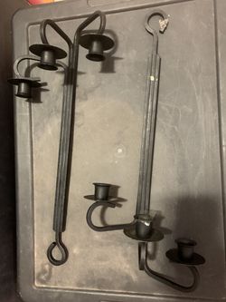 2 candle holders iron