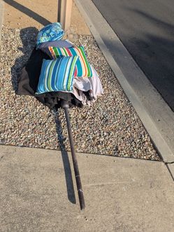 Free metal. 1 umbrella not opening correctly and rusted metal stand. Good for metal only. Pillows are gone.