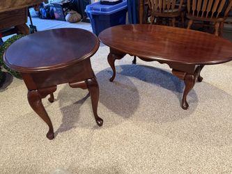 Two Solid Cherry Wood Tables. Used in a dining room.