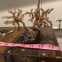 Copper wire tree on a meteorite.  