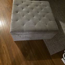 Grey studded storage ottoman