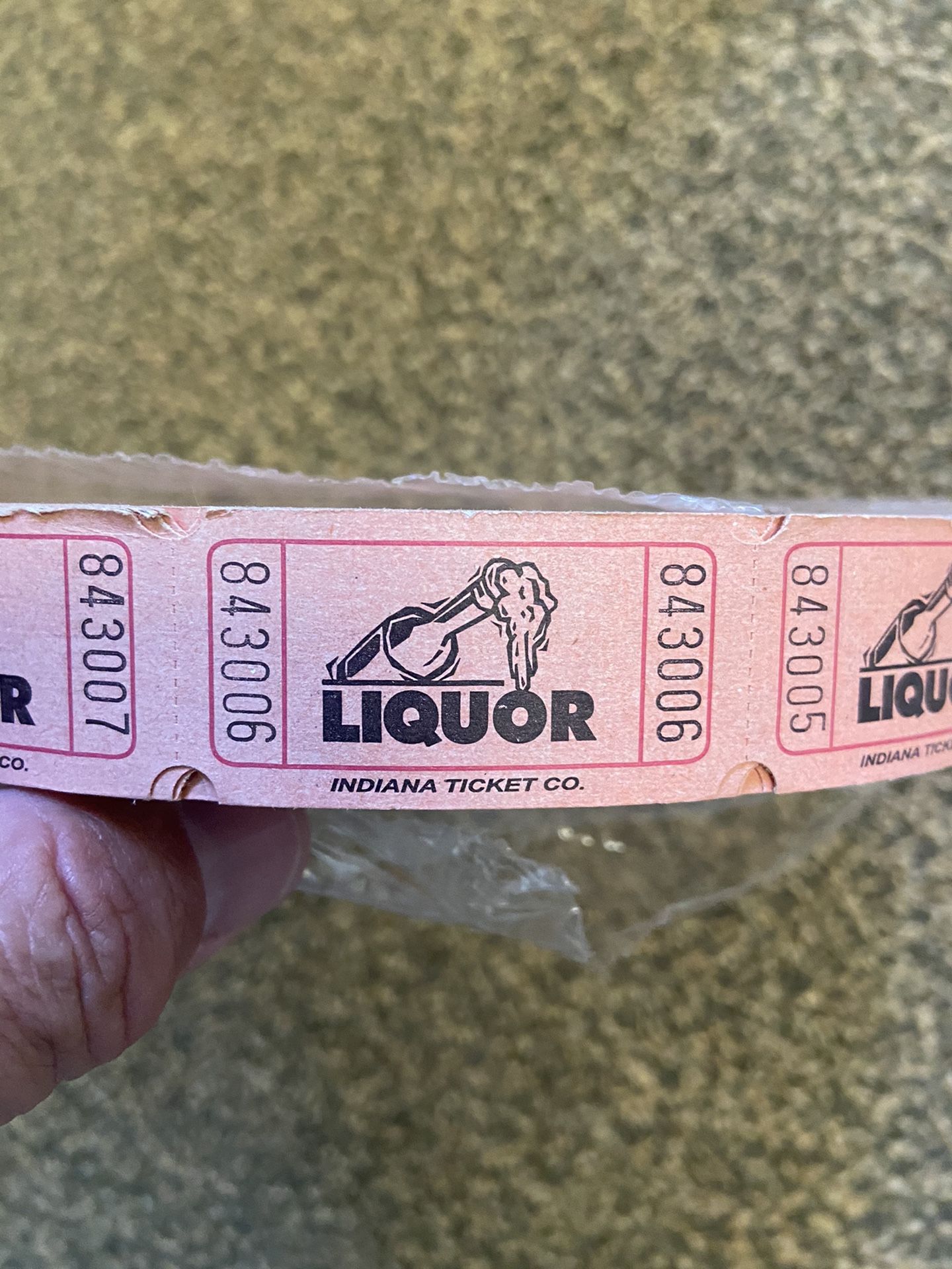 Large unopened roll of liquor tickets