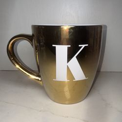 Elegant gold-tone monogrammed coffee mug letter "K" in a bold white serif font!