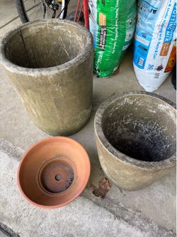 2 cement planter’s pots and 1 clay pot. The larger cement pot is 15”x19” and the other one measures 13 1/2”x 14”