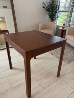 Brown wood extendable kitchen table