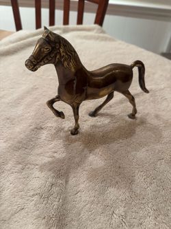 vintage prancing horse figurine features a polished solid brass body with a finely textured mane and detailed halter