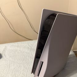 PS5 w/ two controllers and two games.