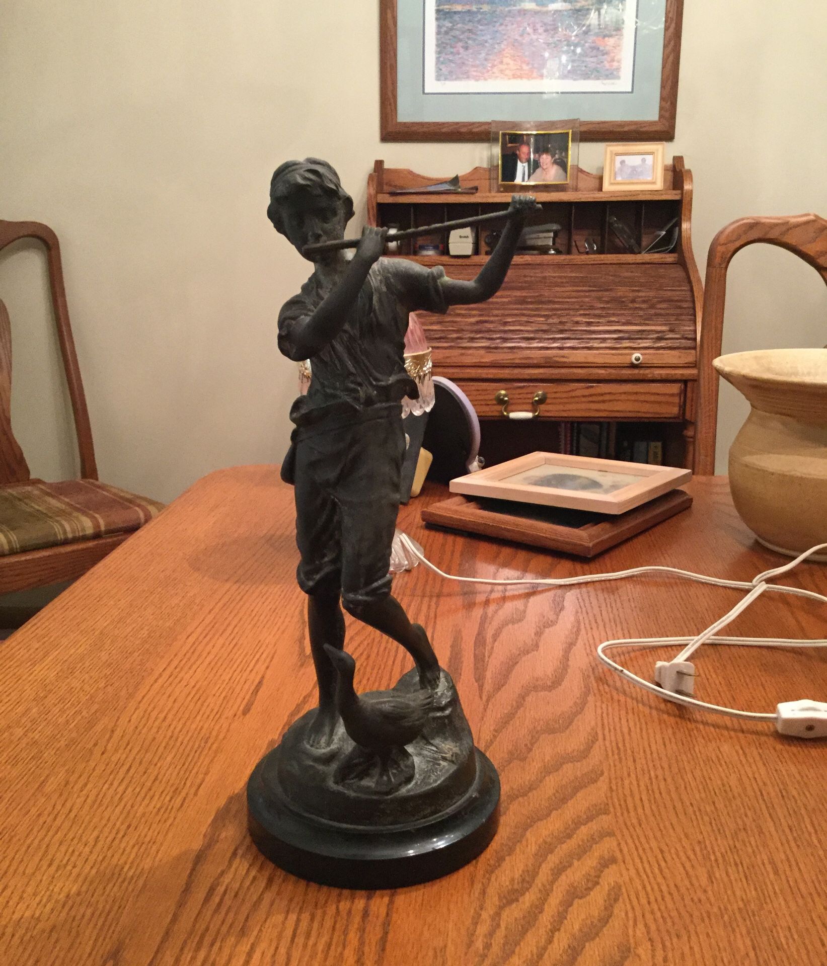 Flute player with goose