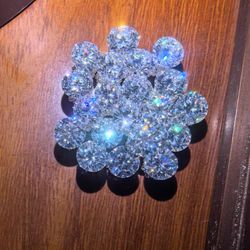 One-carat D-color VVS moissanite gemstone (randomly selected).