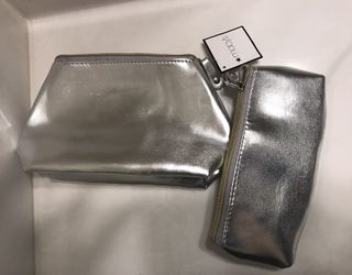 Two silver-colored leather wallet