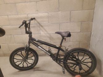 Mongoose Rebel kids BMX bike, 20-inch mag wheels, black