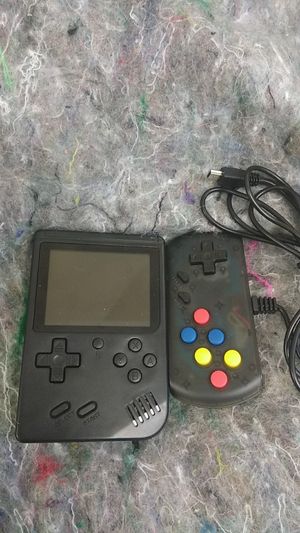 Photo A retro FC plus with Nintendo games like Miss Pac-Man Mario Street Fighter it comes with the controller so second person can play