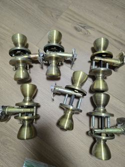 6 brushed antique gold door knobs
