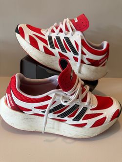 adidas Adizero Aruku in the "Footwear White / Pure Ruby / Core Black" colorway