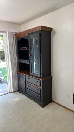 Black and wood china hutch