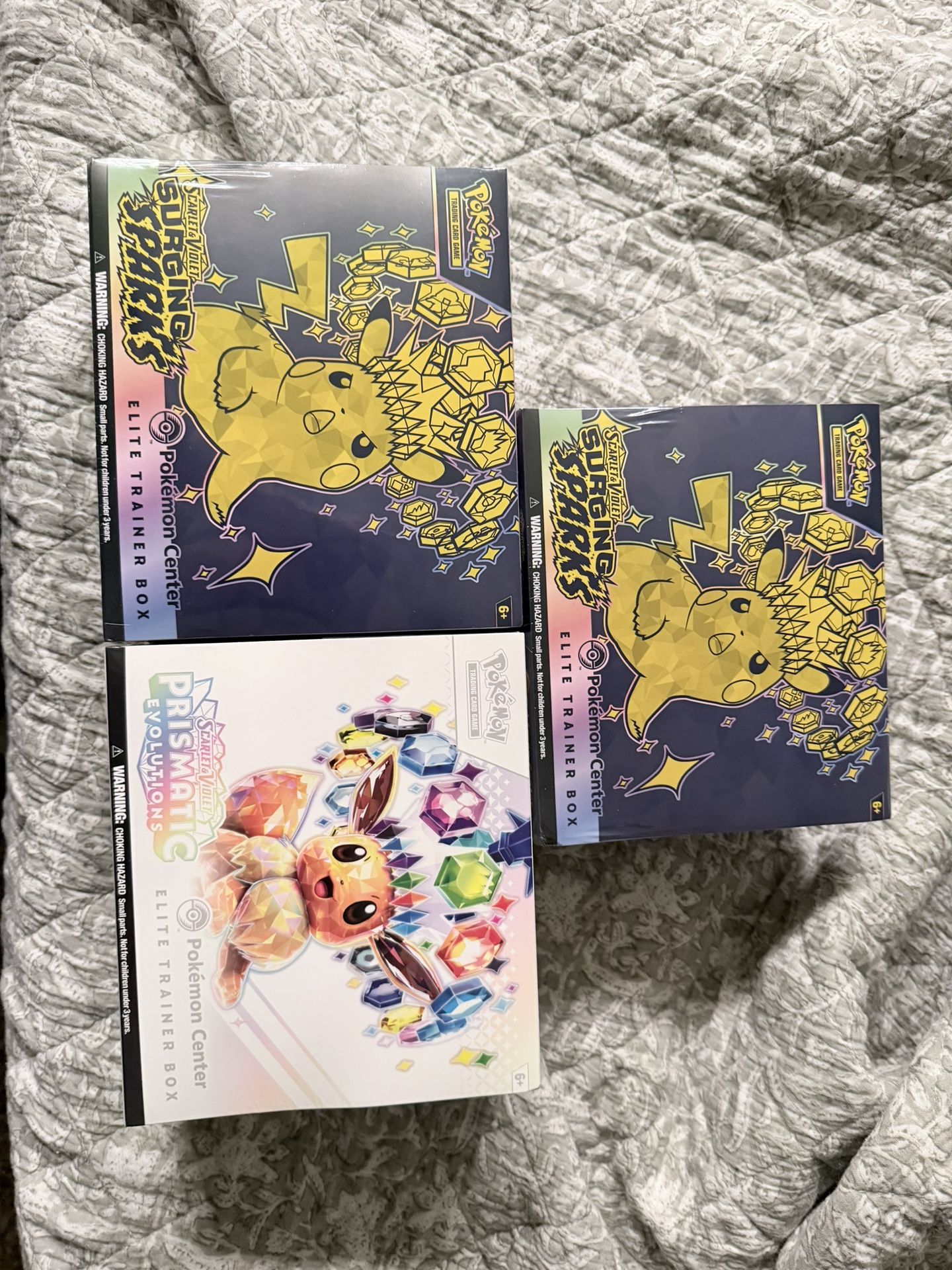 2 Surging Sparks/ Prismatic Evolutions Pokémon Center ETBs