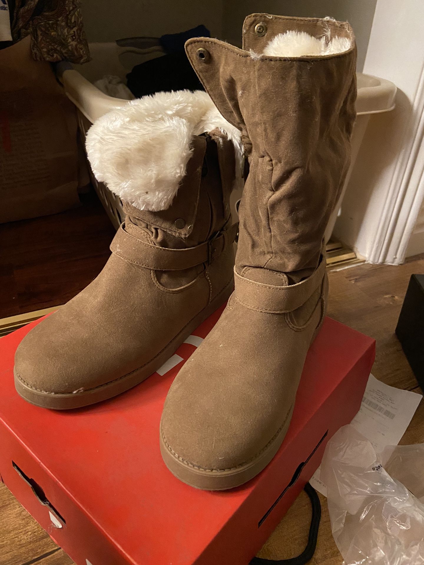 By Guess brown fur boot that is similar to UGGs