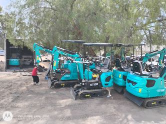 Excavator with set of attachments