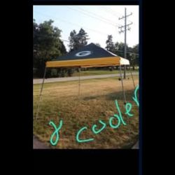 NFL, GREEN BAY PACKERS, Coleman, preowned, 10 x 10  water proof canopy tent w/carrying case, small hole on carrying bag and a new 24 can cooler firm  
