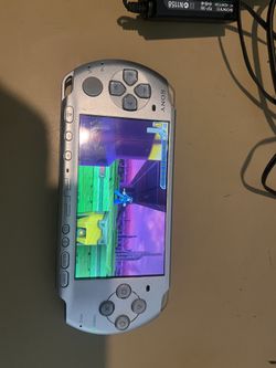 PSP slim w one game  and charger