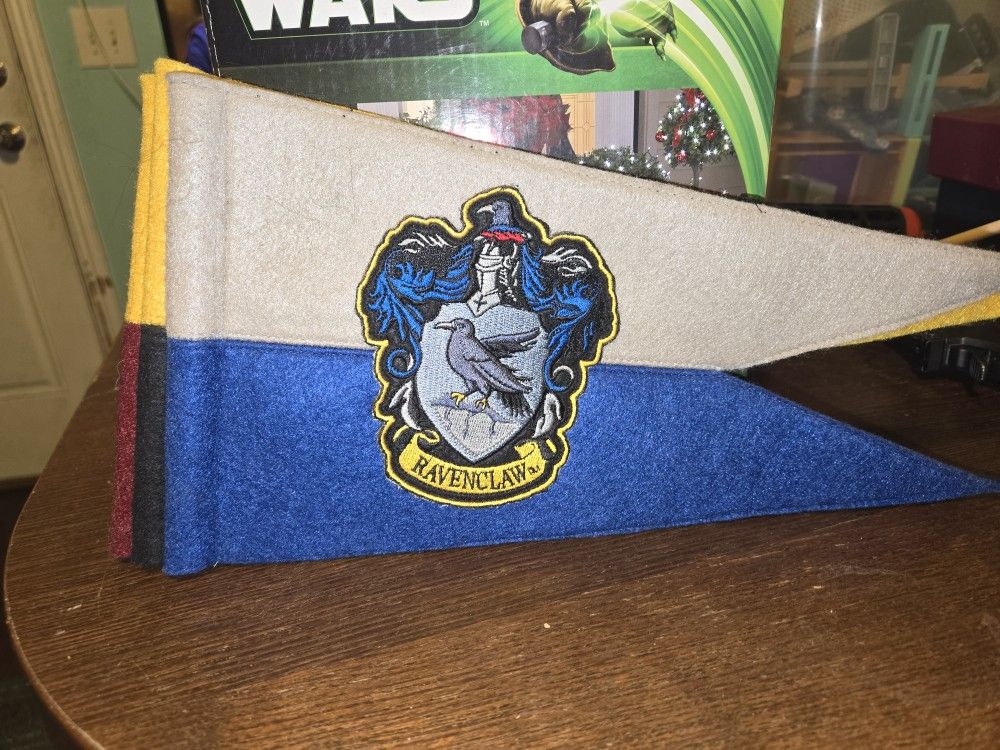 Harry Potter House Banners. Universal Studios. GRYFFINDOR, HUFFLEPUFF,RAVENCLAW,SLYTHERIN and 2 Universal Studios magic interactive wands..