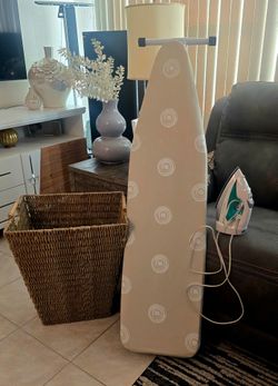 Laundry room accessories, Laundry basket, iron and ironing board.