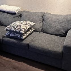 Comfortable and clean sofa with pillows.