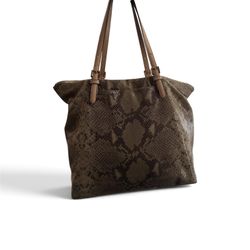Michael Kors This Michael Kors Python Effect tote bag features embossed snakeskin print leather with tan handles and matching wallet