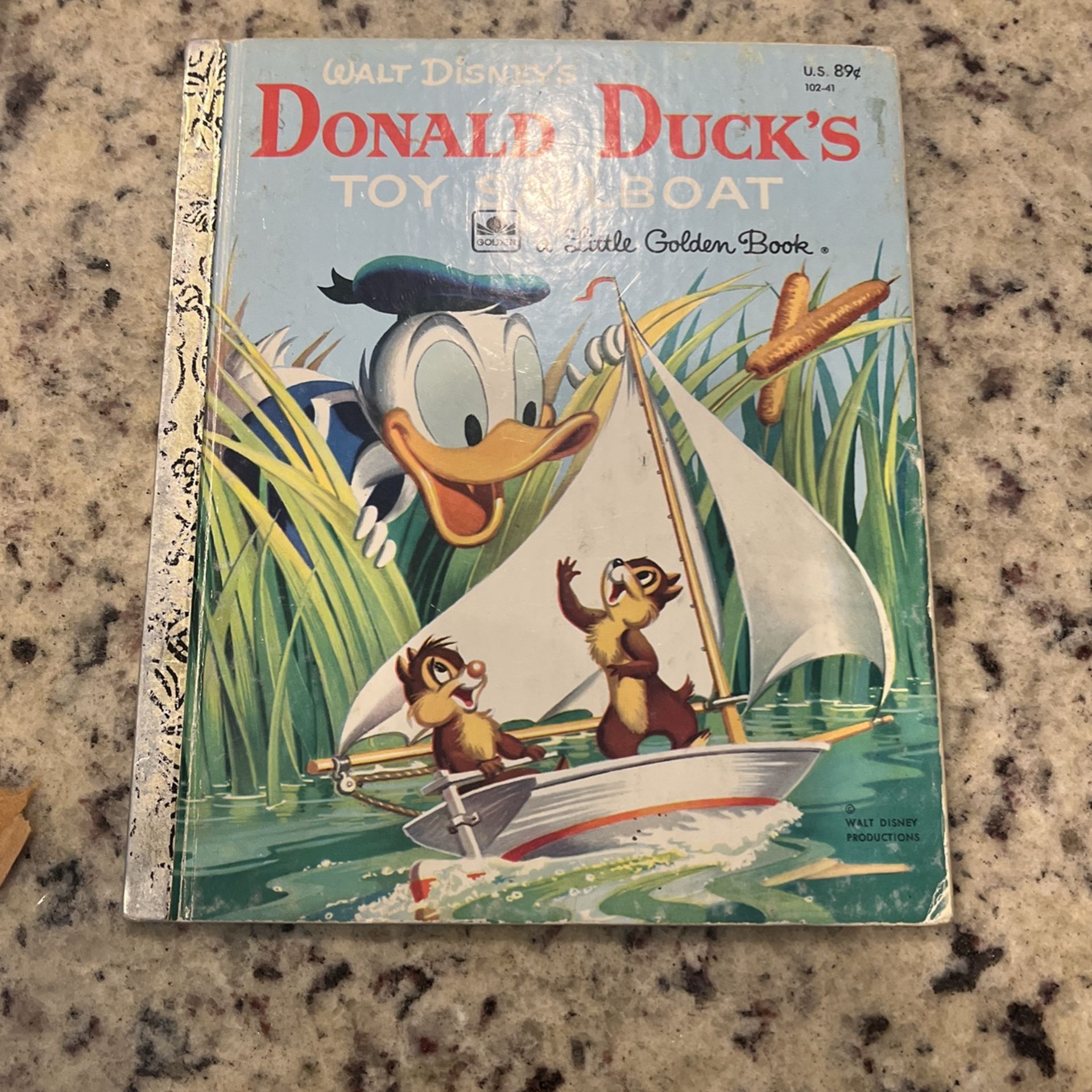 Vintage a little golden Donald Duck , toy, sailboat children’s classic book