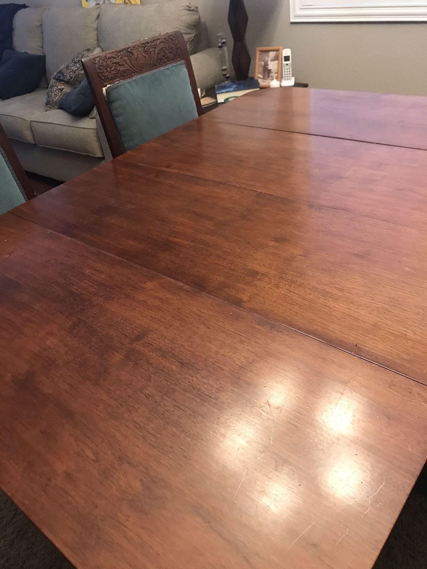 Antique dining table and 6 chairs. Slight repair needed on one chairs upholstery coming loose from frame.
