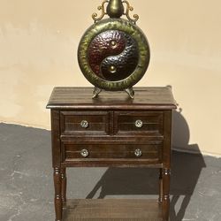 Vintage end table with vase