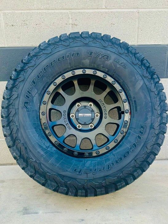 New Method 17x8.5 Black On Black Wheels & 285-70-17 Bf Goodrich Ko2 OR TOYO FALKEN TIRES For: 5/6 LUG Truck Suv (We Finance