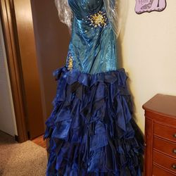 Size 10 Royal Blue Karishma embroidered gown with black and blue ruffles