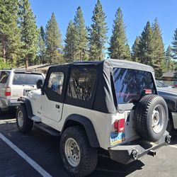 1994 Jeep Wrangler Yj  S. Millage 124,000  Transmission  Manual.  5 Speed. 4crl.   Seat 4.  Exterior  Color White.  Run And  Driver. Clean Tile. 