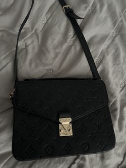 Black purse with strap