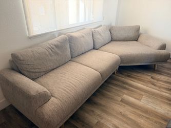 Gray sectional with piano seat