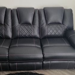 Dual Recliner, Full Size Faux Leather Couch With Stitching.