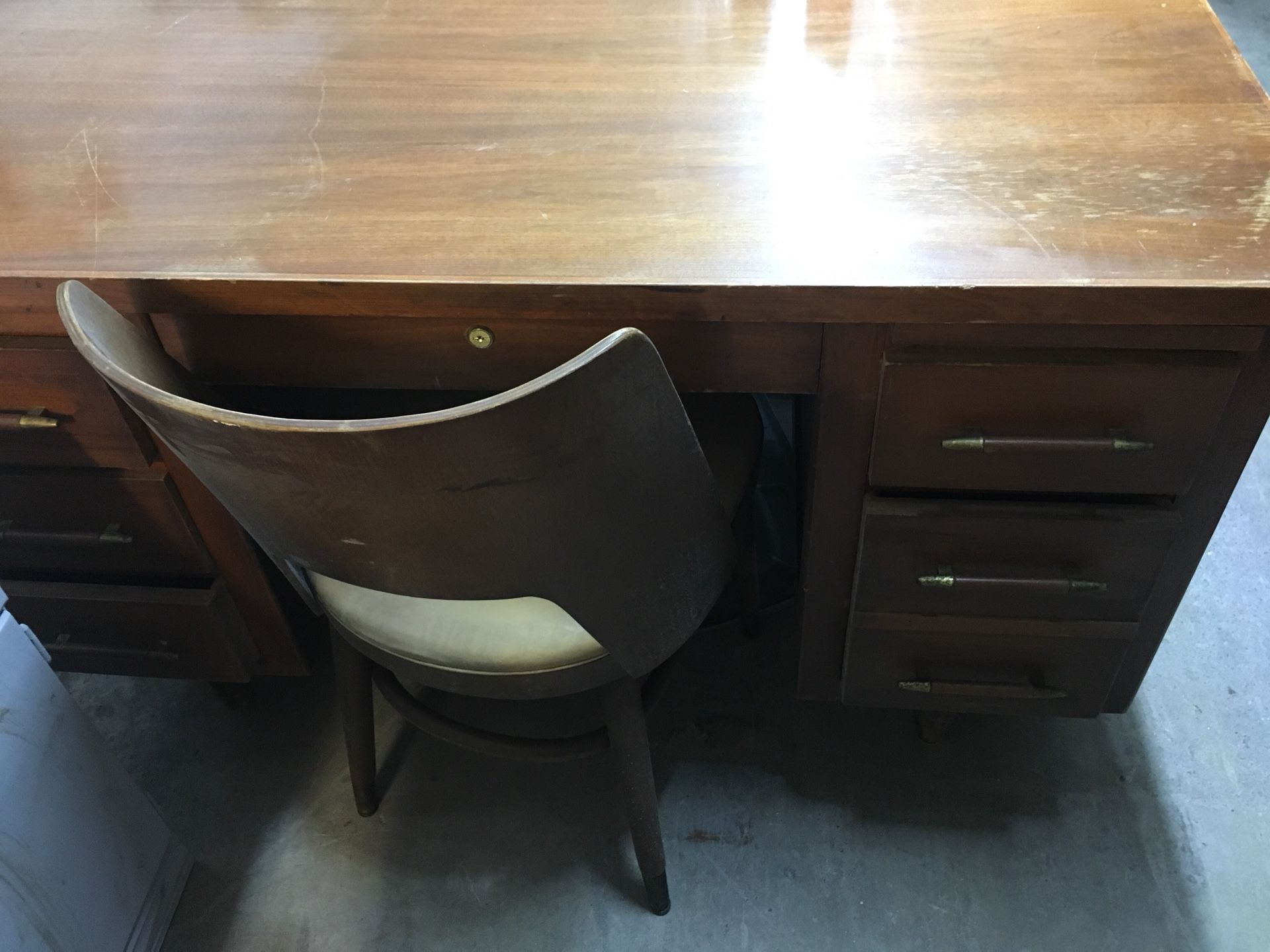 Antique desk with curved back chair